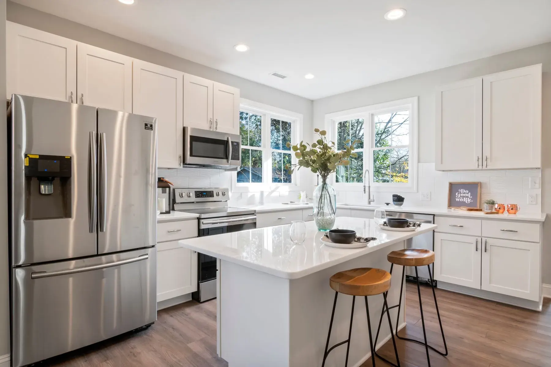 White custom kitchen cabinets with an island in a Lehigh Acres kitchen